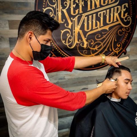Barber giving a fresh cut at Refined Kulture